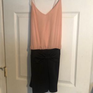 Pink and black romper with bow